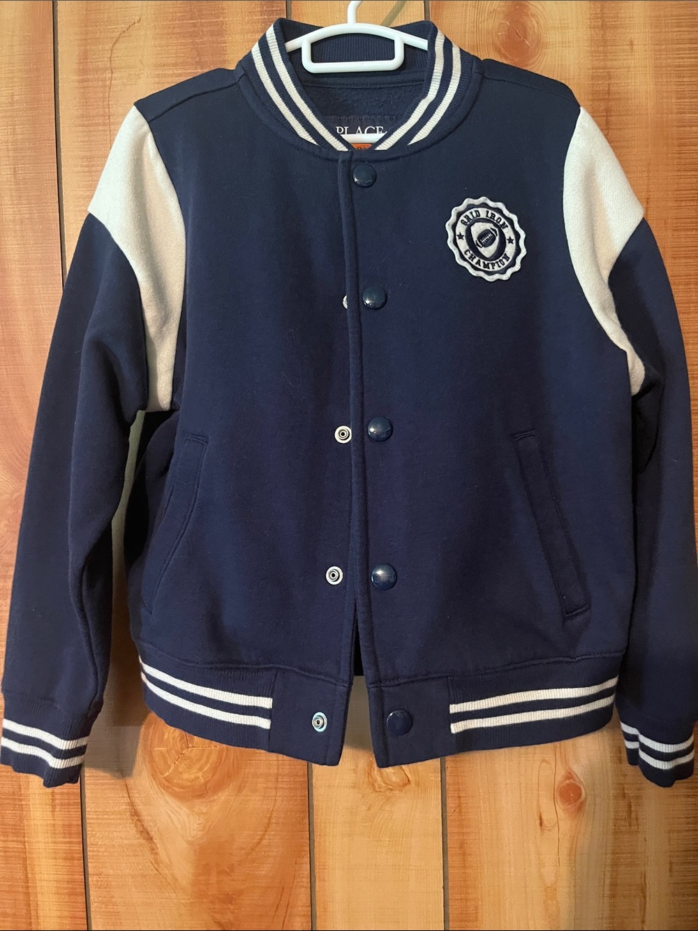 The children’s Place Navy Jacket with Cream Stripe Accent